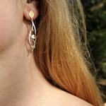 Hanging leaf earrings in gold and silver