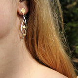 Hanging leaf earrings in gold and silver